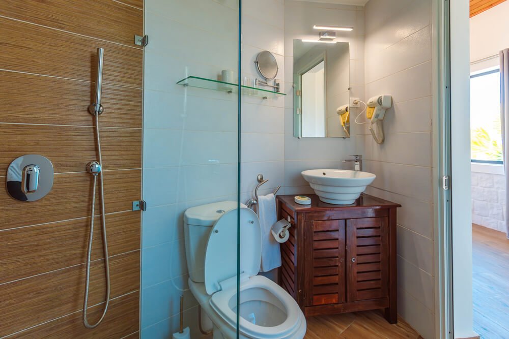 A clean bathroom featuring a toilet and a sink