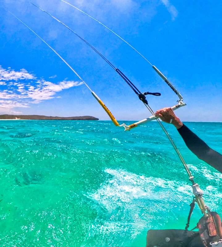 A close-up of a kitesurfer