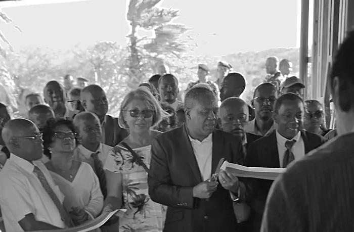 A diverse crowd of people gathers indoors