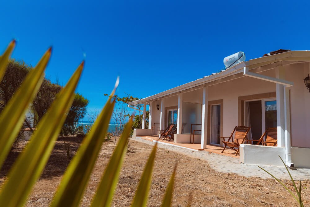 Single-story white house with a porch