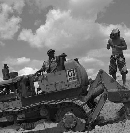 Two workers on a bulldozer