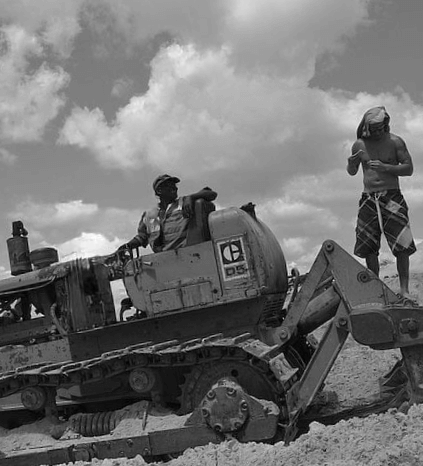 Two workers on a bulldozer